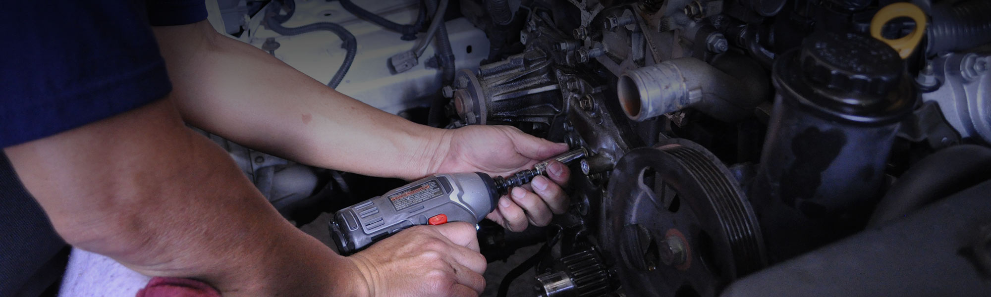 image of mechanic repairing car engine
