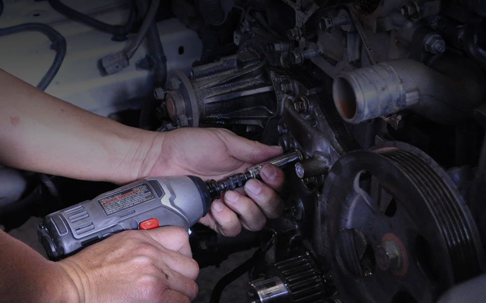 image of mechanic repairing car engine